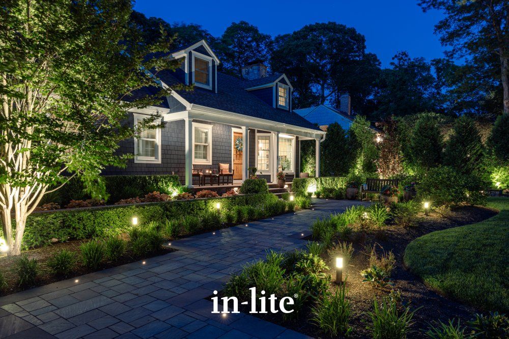 in-lite outdoor path and garden lighting illuminating a residential walkway at dusk